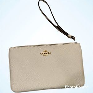 Coach leather wristlet. Excellent preowned condition- gently used one time.